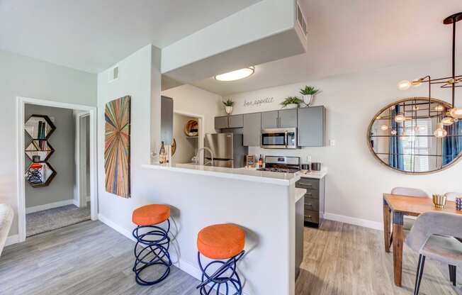 a kitchen and dining area in a 555 waverly unit