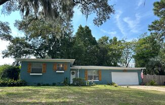 Charming concrete-block home on oversized corner lot that offers 3 bedrooms and 2 bath, 2 car garage!