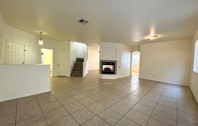 4 bedroom 3 bath home with separate family and living rooms! Tile and vinyl planks throughout as well as a large covered patio!