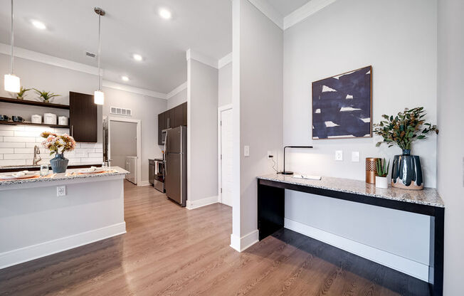 an open kitchen and living room with a counter top