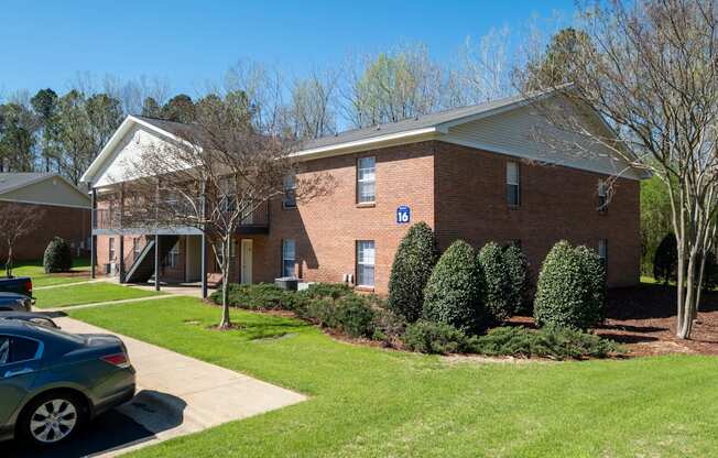 A brick building with a blue sign on it.