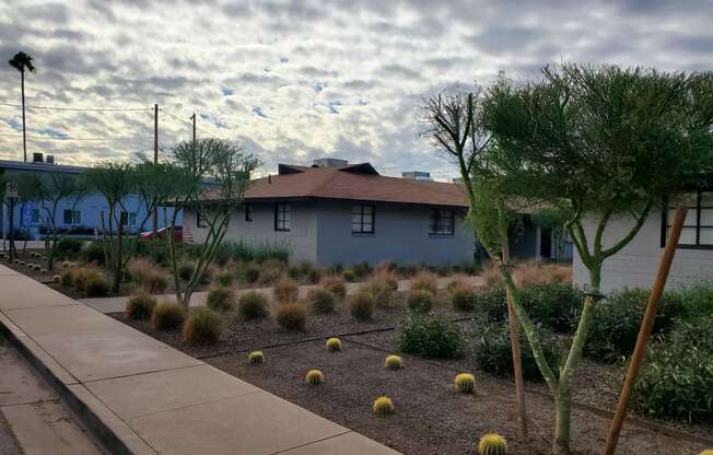 a house with a landscaped garden in front of it