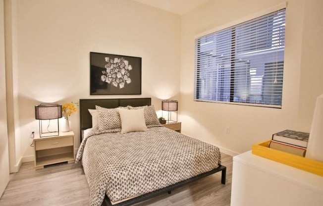 Scottsdale Apartments - Spacious Bedroom with a Large Window and Wood-Style Flooring