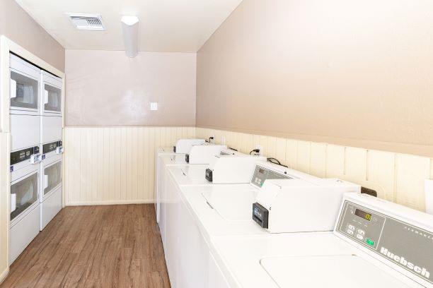 Laundry Center with Machines Next to Folding Counter at Rio Seco Apartments, Tucson, 85746