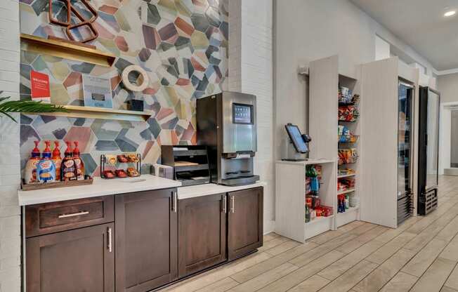 a lobby with a coffee bar and a vending machine