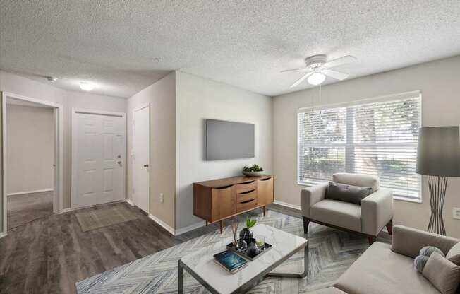 Spacious Living Area With Wood-Style Flooring