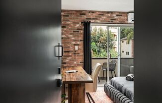 A 3 Bedroom, 2 Bathroom apartment with common areas and a fully functional kitchen at 1700 Malcolm Ave, Unit 204