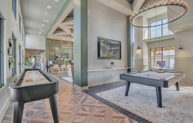 a game room with two shuffleboards and a pool table at Canter, Florida, 34474