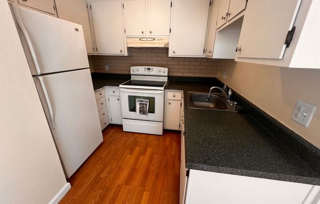 Great condo in a well managed complex with in unit laundry and refrigerator included