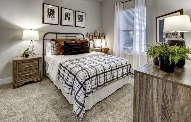 a bedroom with a bed and a table at Arise Riverside, Austin, TX 78741