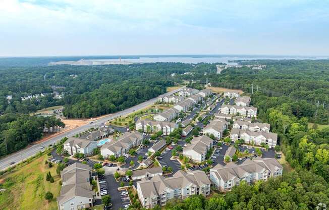 A bird's eye view of a residential area with houses and greenery.