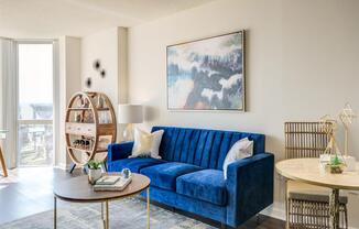 a living room with a blue couch