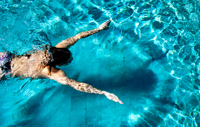 Man swimming in pool