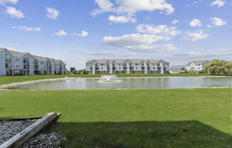 Private patio view of large pond at Hunters Pond Apartment Homes, Champaign, IL