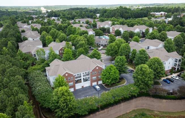 an aerial view of a neighborhood with trees and buildings