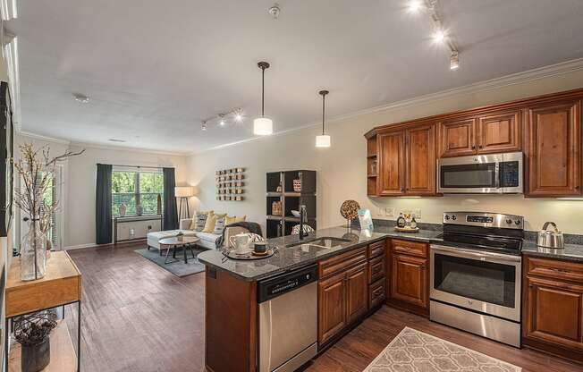 a kitchen with wooden cabinets and stainless steel appliances