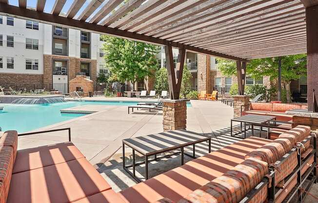 our apartments have a resort style pool and lounge furniture