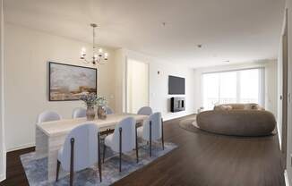 A modern dining room with a large table and chairs.