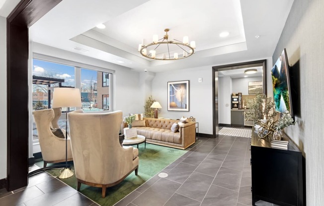 a living room with gray tile flooring and a chandelier hanging from the ceiling