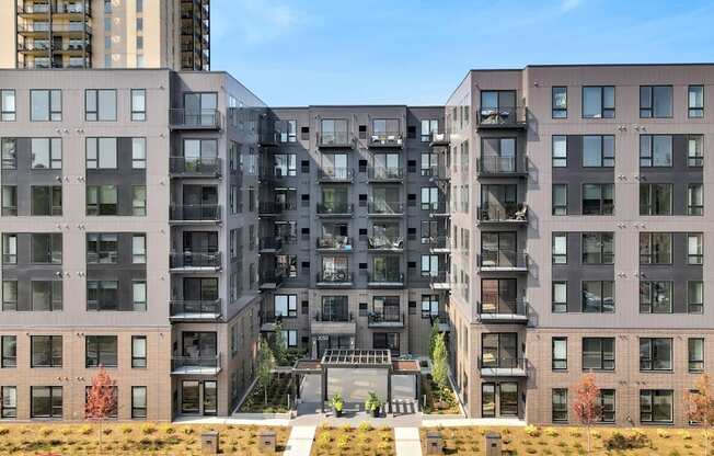 a view of a large apartment building with a staircase in front of it