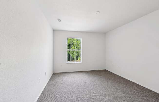 an empty room with a window in it