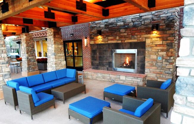 Beautiful Outdoor Lounge with Couches & Fireplace at Longmont CO Apartment Near St Vrain Creek