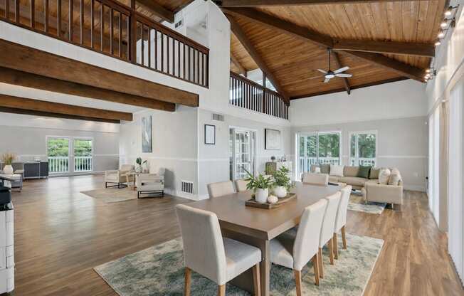 A modern dining room with a wooden table and chairs.