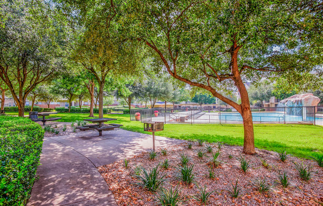 Grills and seating in the courtyard at Tuscany Square Apartments in North Dallas, TX. Now leasing studios, 1 and 2 bedroom apartments.