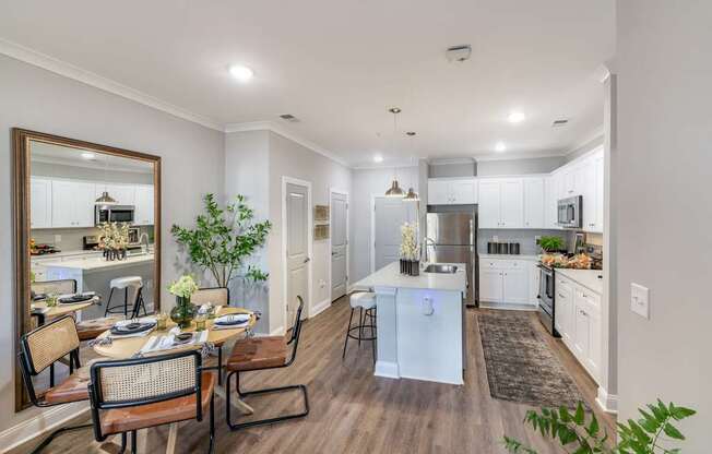 A modern kitchen with a dining table and chairs. at The One at Spartanburg, Spartanburg, South Carolina