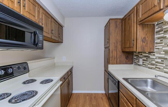 a kitchen with a stove top oven