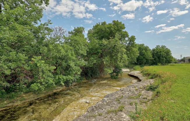 Creek at The Villas at Quail Creek Apartments in Austin Texas June 2021