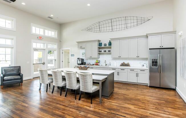 a room filled with furniture on top of a hard wood floor