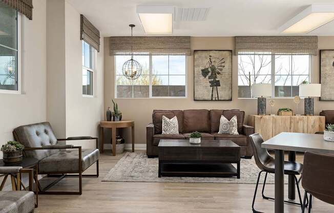A living room with a brown couch and a wooden coffee table.