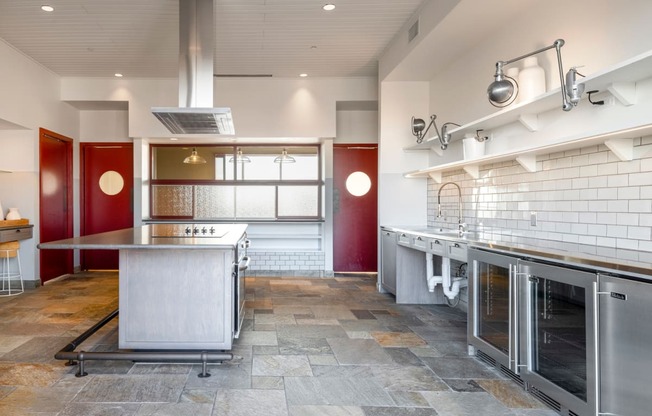 a large kitchen with stainless steel appliances and a counter top
