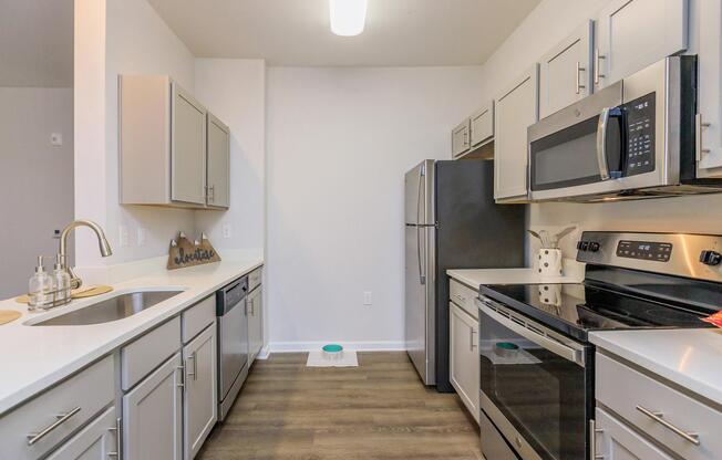 a kitchen with a stove and a refrigerator