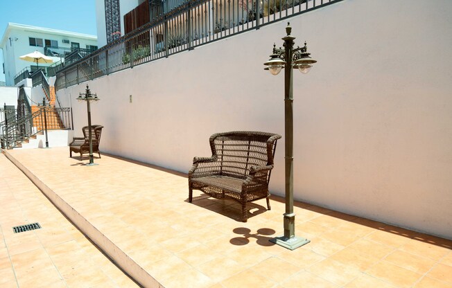 bench in common area with outdoor lamps