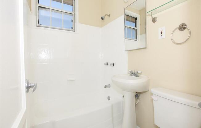 Bathroom with vanity and tub