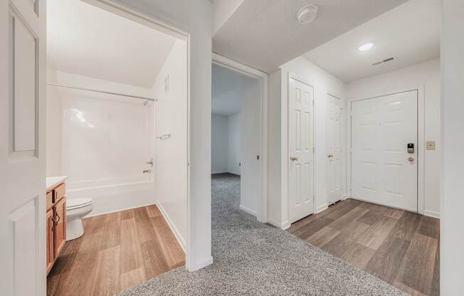 A white bathroom with a toilet and a sink.