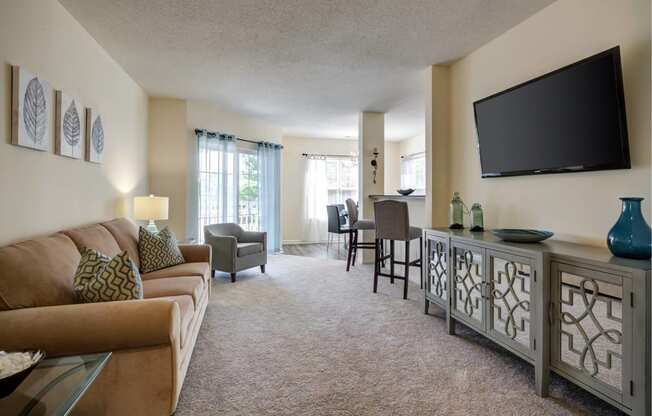 a living room with a couch and a television