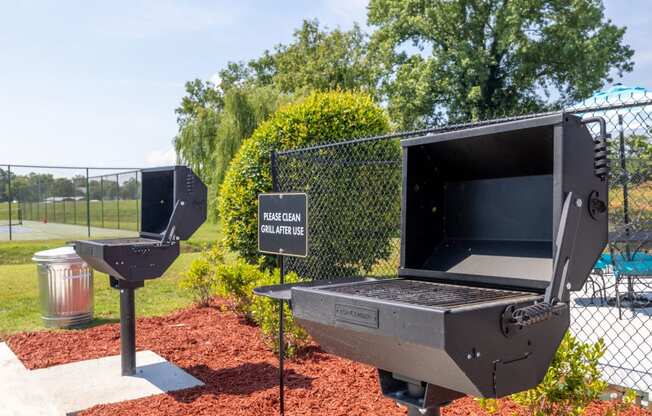 a grill and two urinals in a park with a cyber crime