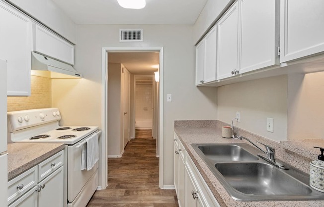 This is a photo of the kitchen in the 650 square foot 1 bedroom, 1 bath apartment at Preston Park Apartments in Dallas, TX