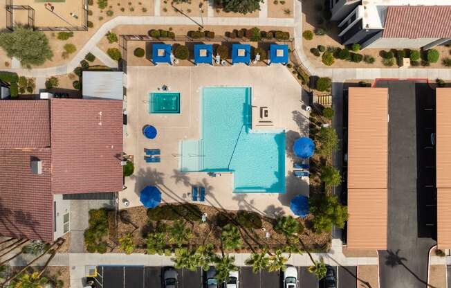 arial view of a house with a swimming pool in the middle of it