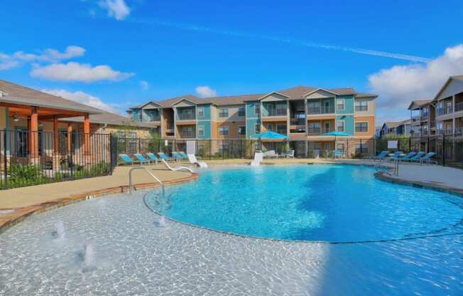 Volar Apartments Pool with Lounge Chairs