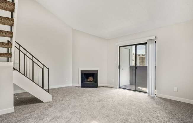 A living room with a fireplace and loft at Hilltop View Apartments