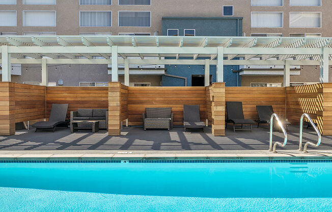 Gorgeous pool with divided cabana lounging space