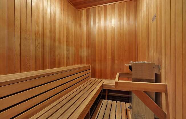 A wooden sauna with benches at Park Rochester, Los Angeles, CA, 90024.