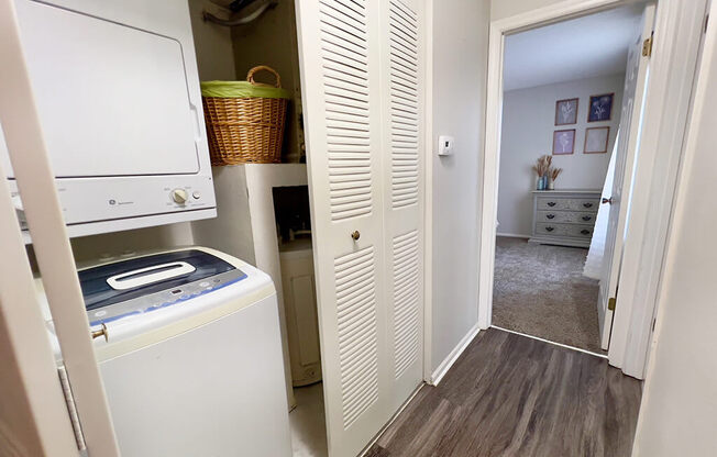 a laundry room with a washer and dryer and a closet