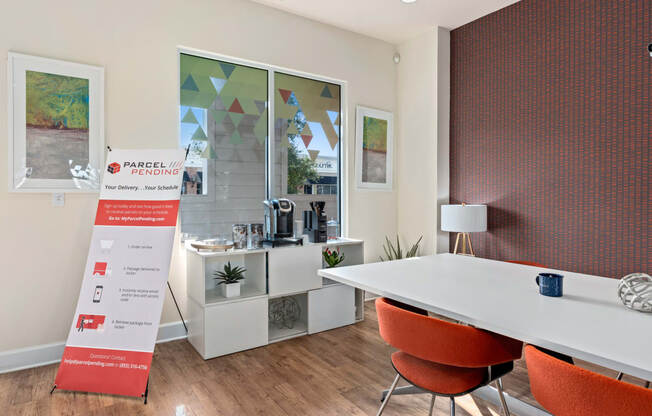 a conference room with a table and chairs and a sign