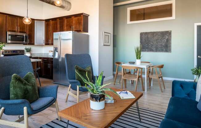 an open concept living room with a kitchen and dining area at The 22 Apartments, St. Louis, MO 63103