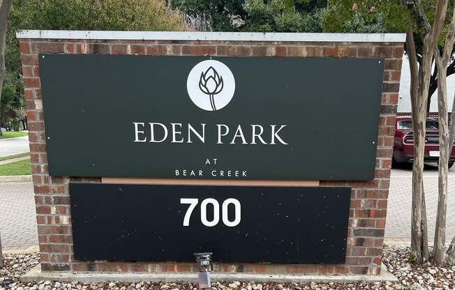 a sign that is on the side of a brick building